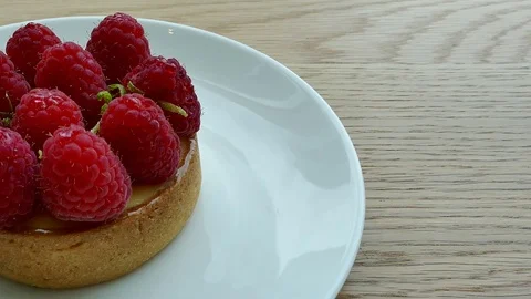 Tart Raspberry in white plate Stock Footage 81400901