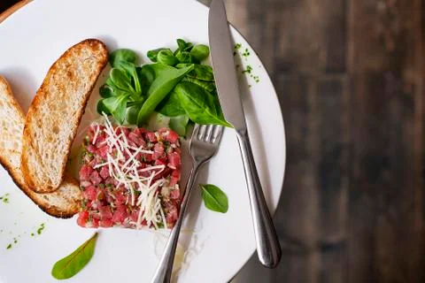 Tartare of beef with spinach. Stock Photos
