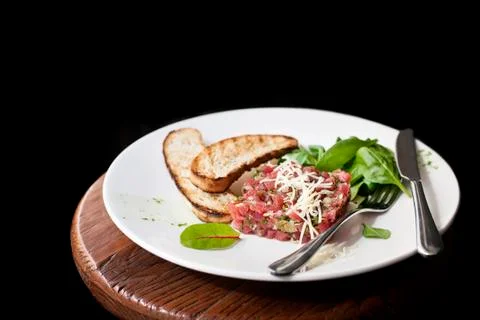 Tartare of beef with spinach. Stock Photos