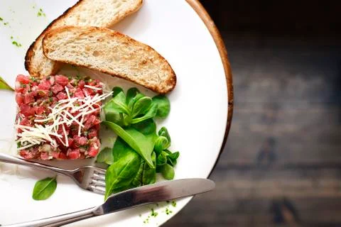 Tartare of beef with spinach. Stock Photos
