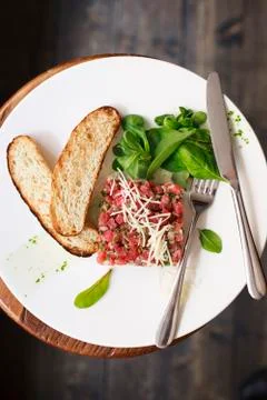 Tartare of beef with spinach. Stock Photos