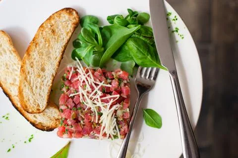Tartare of beef with spinach. Stock-Fotos