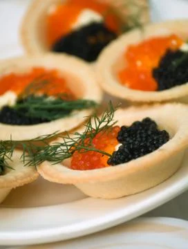 Tartlet with red caviar Stock Photos