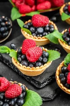 Tartlets with berries Stock Photos