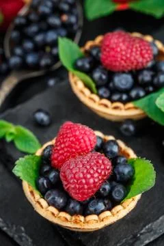Tartlets with berries Stock Photos