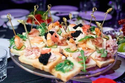 Tartlets with caviar on a table Foto stock
