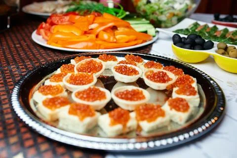 Tartlets with caviar on a table Foto stock
