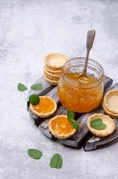 Tartlets with orange jam Stock Photos