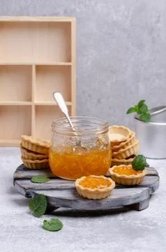 Tartlets with orange jam Stock Photos