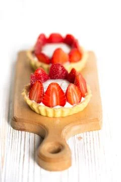 Tartlets with raspberries Stock Photos