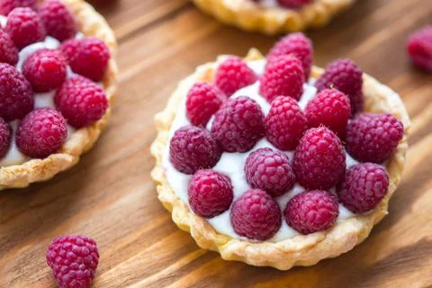 Tartlets with raspberry Stock Photos