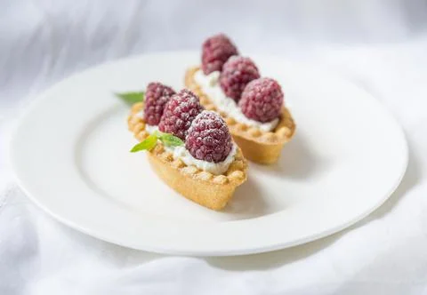 Tartlets with raspberry Stock Photos