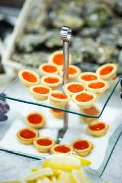 Tartlets with red caviar Stock Photos