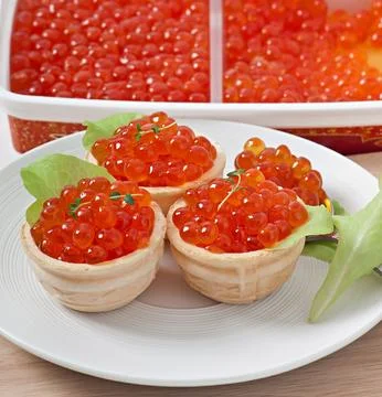 Tartlets with red caviar Stock Photos