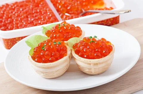 Tartlets with red caviar Stock Photos