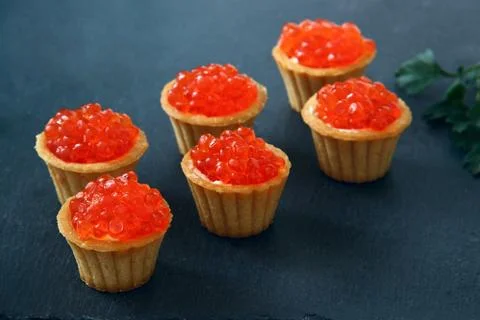 Tartlets with red caviar. Selective focus, space for text . serve red caviar Stock Photos