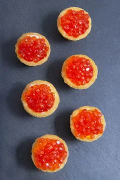 Tartlets with red caviar. Selective focus, space for text . serve red caviar  Stock Photos