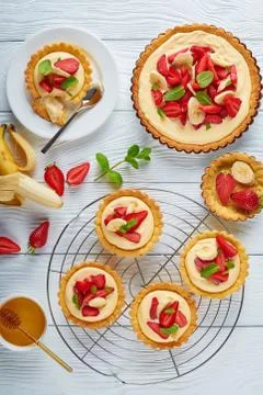 Tartlets with strawberries on a table Stock Photos