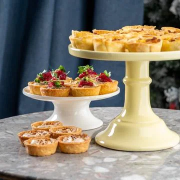 Tartlets stuffed with codfish liver, codfish caviar and microgreens. Traditional Stock Photos