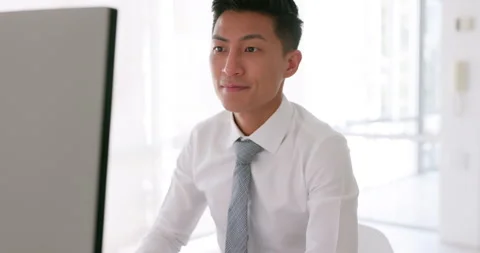 Task, complete and relax with a business asian man at work on his computer with Stock Footage 228769186