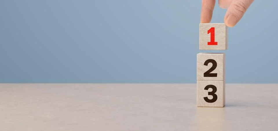 Task priority and management concept. Wooden cube blocks with number first,.. Stock Photos