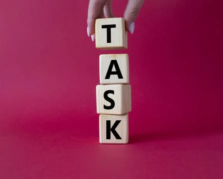 Task symbol. Concept word Task on wooden cubes. Businessman hand. Beautiful.. Foto stock