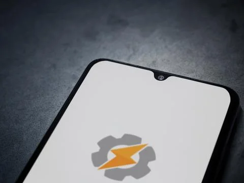 Tasker app launch screen on smartphone on dark marble stone background Stock Photos