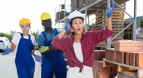 Taskmaster amazed by something in outdoor warehouse Stock Photos