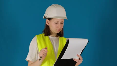 Taskmaster in helmet with papers checks repair conducting Stock Footage 274351726