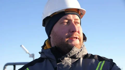 Taskmaster talks to workers at waste water treatment plant Stock Footage 155352272