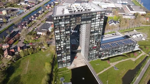 Tasman Tower, a modern apartment complex in Groningen, orbiting from the air Video stock 181236174
