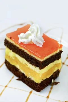 Tasteful multilayer cake closeup vertical photo. cakes collection. Foto stock