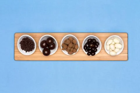 Taster dishes of assorted chocolates Stock Photos