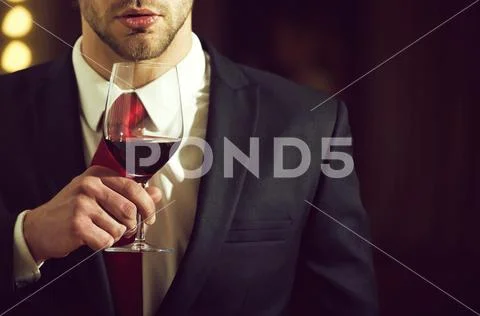 Taster of wines. wine glass in hand of man, meeting and relax Stock Photos