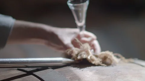 Tasting and testing port from a barrel Video stock 93679301