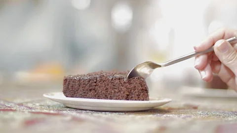 Tasting a brownie with a spoon Stock Footage 79097654
