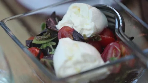 Tasting caprese salad Stock Footage 131984835