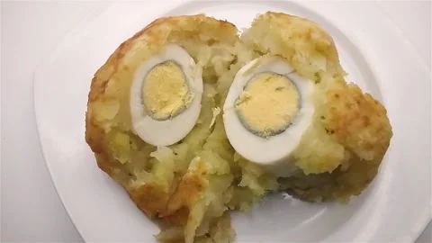 Tasting deep fried cassava puree egg ball with breaded fried shrimps. Stock Footage 281953652