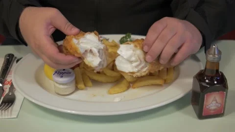 Tasting Fish and Chips at a Chippy in London Stock Footage 154115860