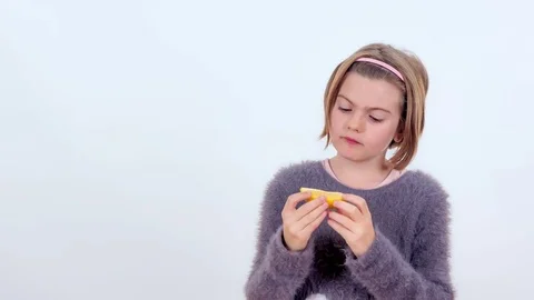 Tasting a lemon which is very sour Stock Footage 83724864