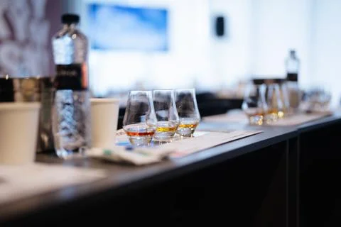 Tasting session featuring a variety of spirits and refreshments at a conference Stock Photos