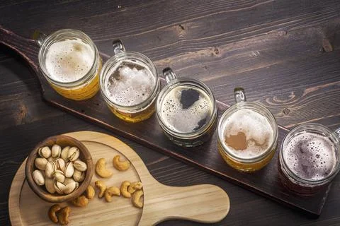 Tasting set of different types of beer with snacks Fotos de archivo
