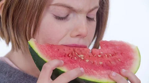 Tasting a watermelon and then it falls out of her mouth Stock Footage 83725652