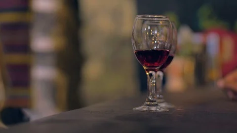 Tasting wine in a  old cellar The taster takes the glass of wine Stock Footage 106015093