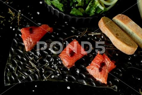 Tasty and healthy food. Black background, handmade pottery. Table with delicious Stock-Fotos