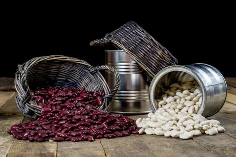 Tasty beans in a basket on a kitchen table. Autumn season. Wooden table. Stock Photos