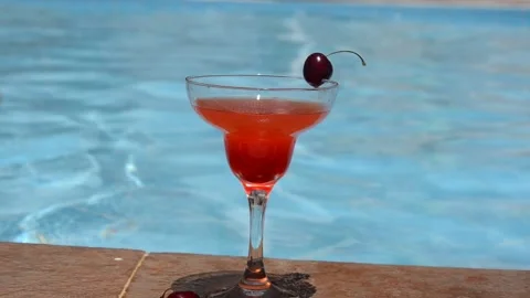 Tasty beautiful watermelon or strawberry with a cherry on a glass pool 库存影片 133341353