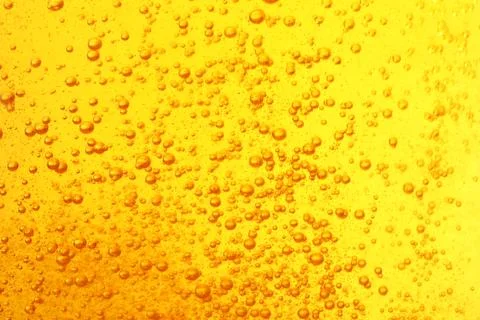 Tasty beer with bubbles as background, closeup Stock Photos