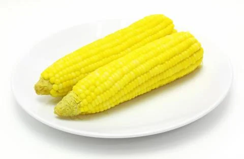 Tasty boiled yellow corn on the table Stock Photos