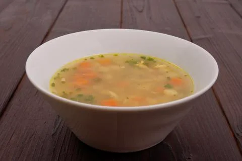 Tasty bread soup with vegetables on a table Stock Photos